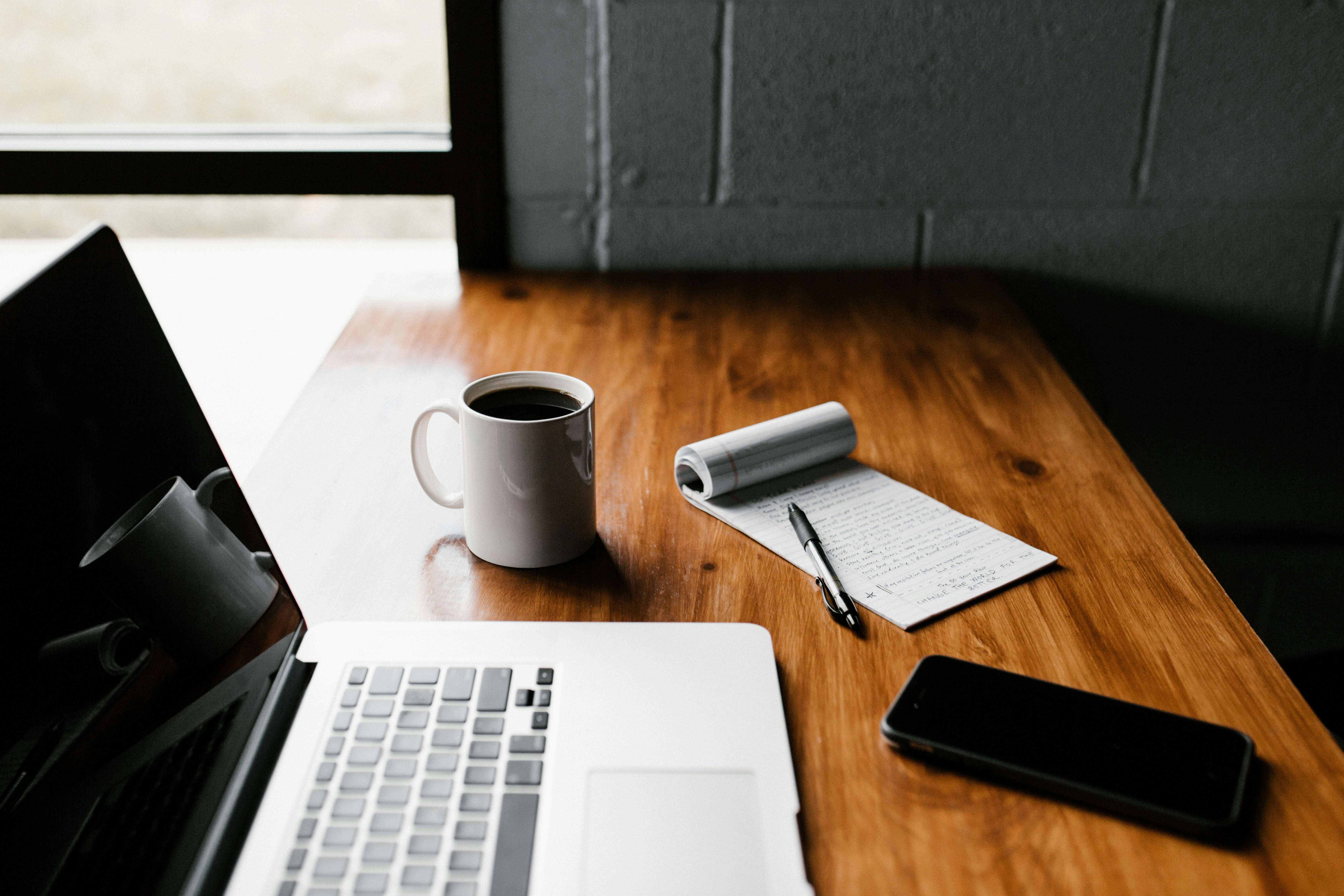 Desk workspace with a laptop and notebook, used while working through Google Search Console indexing steps
